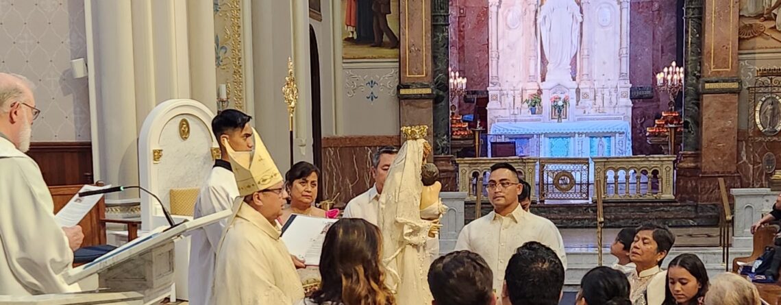 Bishop Esmilla with Our Lady of FIAT statue on the altar of Basilica Shrine