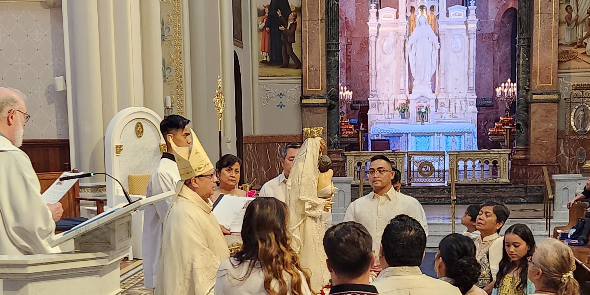 Bishop Esmilla with Our Lady of FIAT statue on the altar of Basilica Shrine