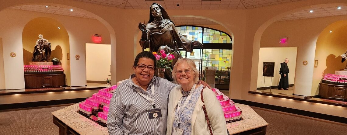 Two women standing in front of St. Rita of Cascia Shrine