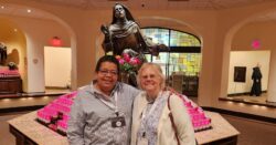 Two women standing in front of St. Rita of Cascia Shrine