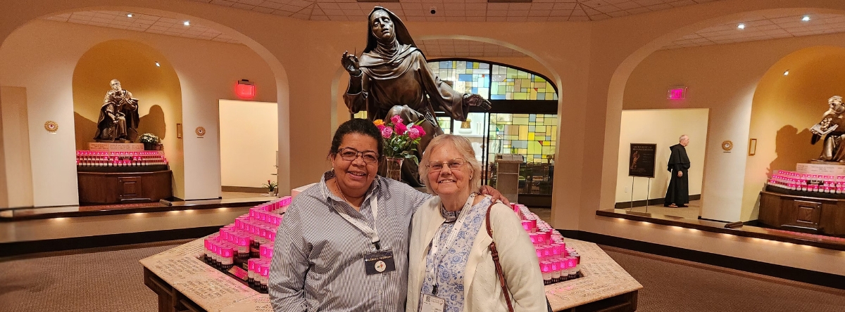 Two women standing in front of St. Rita of Cascia Shrine